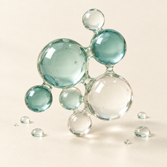 Clear and sea-green spheres joined like a molecule, representing amino acids